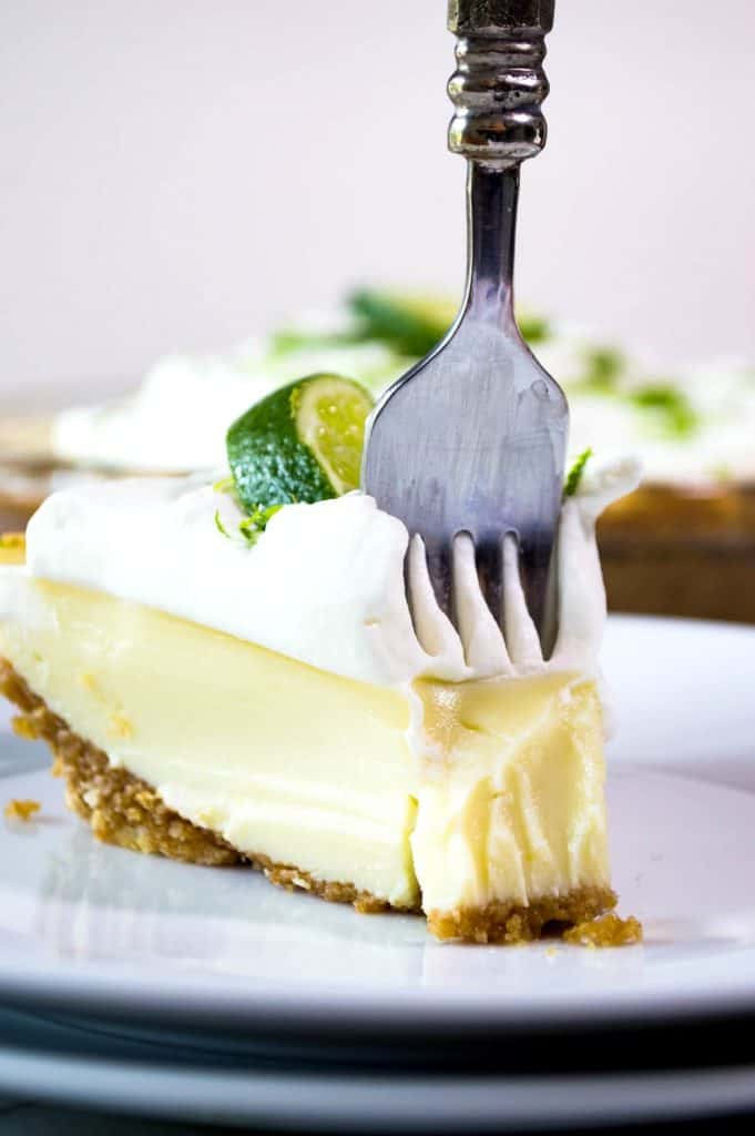 Tequila Lime Pie! An ultra creamy, lime pie laced with a hint of tequila! Almost like enjoying a bite of margarita! 