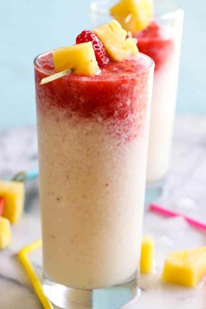 Virgin Lava Flow Slush! Enjoy the tropical flavors of pineapple, coconut and banana swirled with strawberry in this frosty and slushy drink! Feel free to add a little rum if desired! The perfect summertime drink!