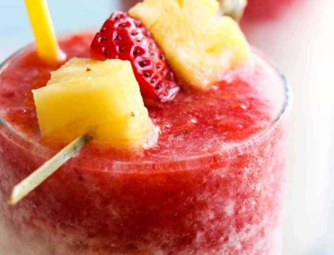 Virgin Lava Flow Slush! Enjoy the tropical flavors of pineapple, coconut and banana swirled with strawberry in this frosty and slushy drink! Feel free to add a little rum if desired! The perfect summertime drink!