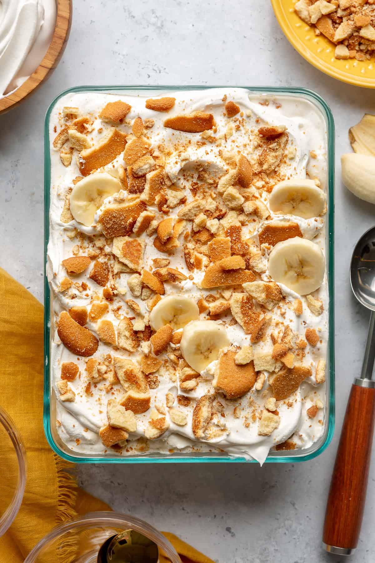 Dish of banana pudding ice cream topped with crushed vanilla wafers. 