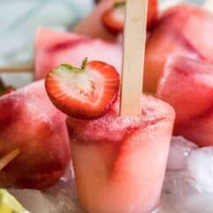 Strawberry Lemonade Popsicles!  Homemade lemonade and fresh cut strawberries meld together to create refreshing popsicles loaded with a sweet lemon flavor. 