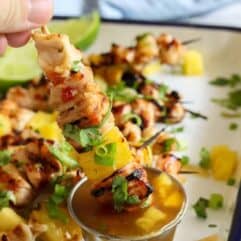Sweet Chili Grilled Chicken and Pineapple!  Chicken marinated in a flavorful sweet chili sauce made with simple ingredients.  Grilled with chunks of pineapple for a sweet and spicy summer time meal! 