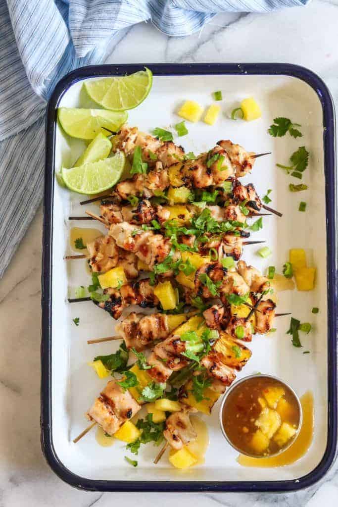 Sweet Chili Grilled Chicken and Pineapple!  Chicken marinated in a flavorful sweet chili sauce made with simple ingredients.  Grilled with chunks of pineapple for a sweet and spicy summer time meal! 