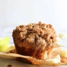 Single Apple Crumb Muffin with the wrapper removed.