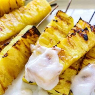 Grilled Pineapple with Coconut Rum Sauce.  Sweet, juicy, caramelized grilled pineapple drizzled with a creamy coconut rum sauce.  Tropical paradise! 