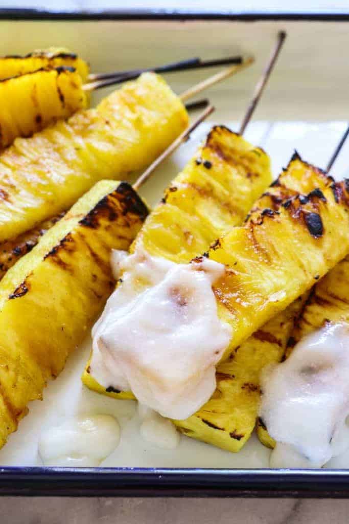 Grilled Pineapple with Coconut Rum Sauce.  Sweet, juicy, caramelized grilled pineapple drizzled with a creamy coconut rum sauce.  Tropical paradise! 