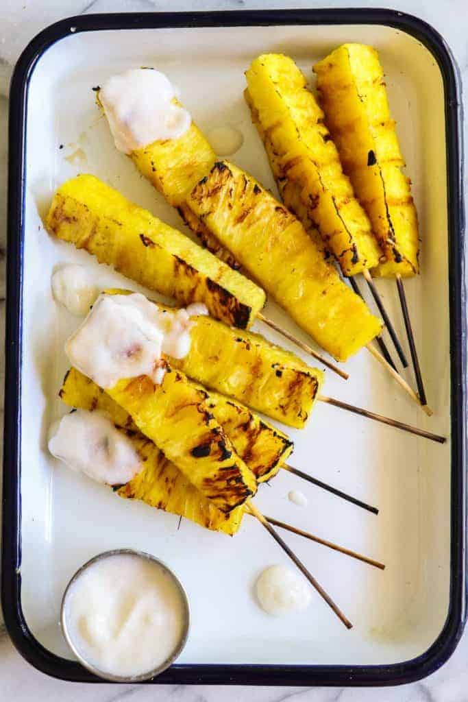 Grilled Pineapple with Coconut Rum Sauce.  Sweet, juicy, caramelized grilled pineapple drizzled with a creamy coconut rum sauce.  Tropical paradise! 