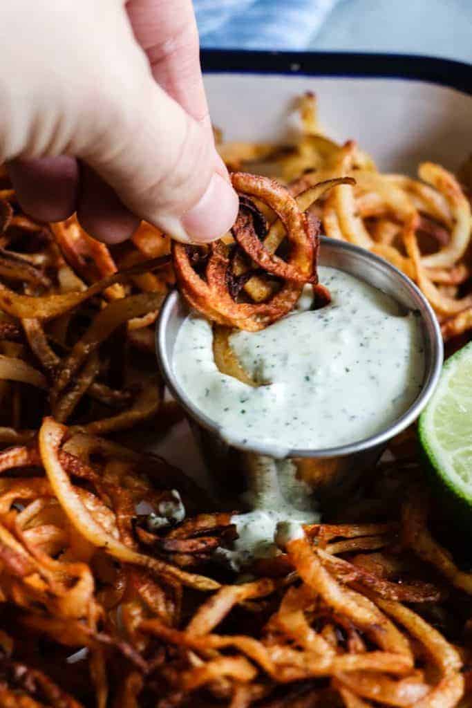 Homemade crispy fries seasoned with chile powder and hit with a dose of lime. Perfect side dish to any Mexican dish or just snacking on! 
