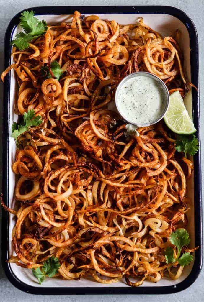 Homemade crispy fries seasoned with chile powder and hit with a dose of lime. Perfect side dish to any Mexican dish or just snacking on! 