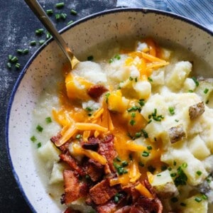 This Potato Soup is smooth and creamy. Loaded with chunks of potato. Plus it's secretly healthy, made with no milk or cream!