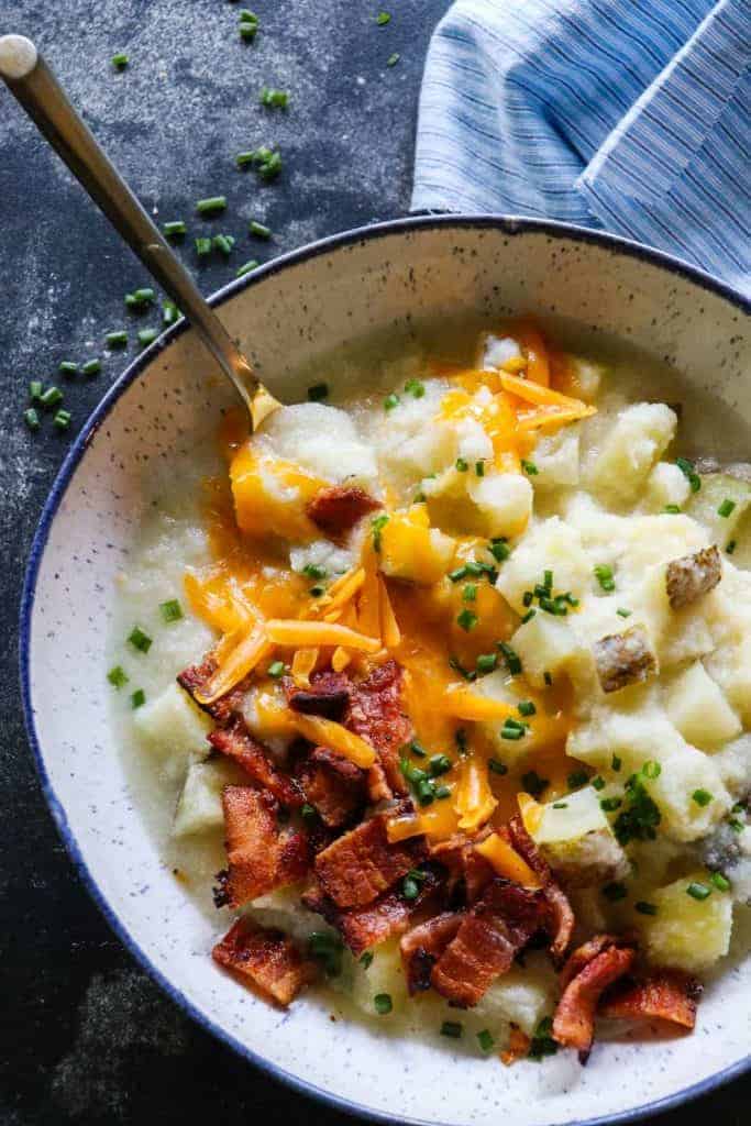 This Potato Soup is smooth and creamy. Loaded with chunks of potato. Plus it's secretly healthy, made with no milk or cream! 