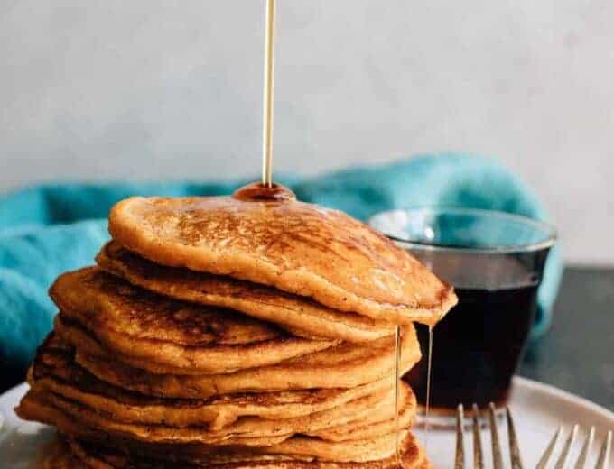 Soft and fluffy sweet potato pancakes made to the extreme with an overdose of spices and sweetened with maple syrup. Fall breakfast perfection.