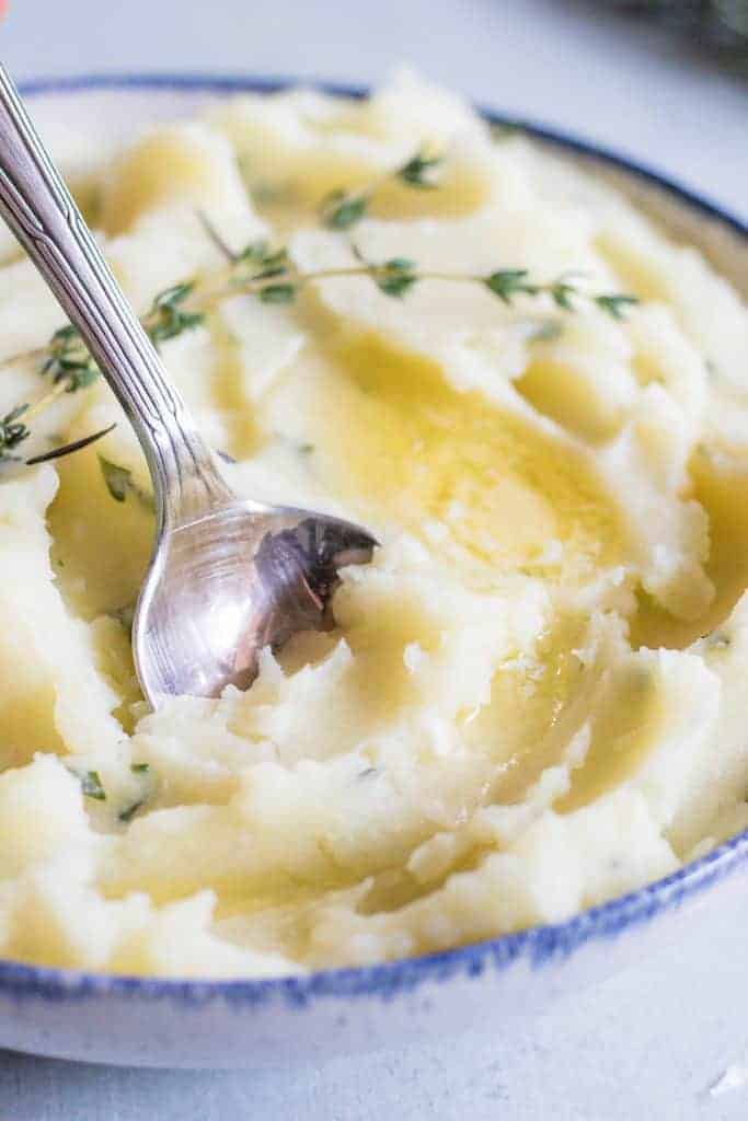 The creamiest mashed potato loaded up with garlic and herbs in every bite! Perfect side dish for any meal.
