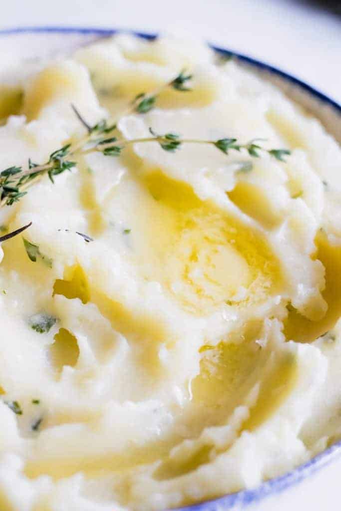 The creamiest mashed potato loaded up with garlic and herbs in every bite! Perfect side dish for any meal.