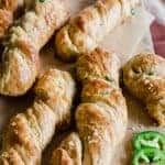 Soft pretzel twists loaded up with cheese and bits of jalapeño! The perfect salty snack. 