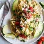 Easy migas are the Tex-Mex way to start your day! Soft and cheesy scrambled eggs loaded up with peppers, onion, and fried tortillas.