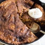 Pumpkin Chai Cobbler, a magical cake made by pouring hot chai tea over a pumpkin batter that bakes into a cake with a layer of a caramel like sauce underneath. 