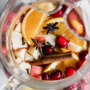 Sparkling Apple Cider Sangria. Sparkling Apple cider loaded up with chunks of apple, orange, cranberries, and all the best fall spices. No alcohol included makes this perfect for the entire family!