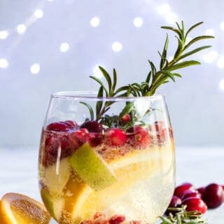 Sparkling White Sangria. This festive drink is super easy to put together and definitely makes a statement. Loaded with cranberries, pears, and oranges this drink is perfect for celebrating the Holidays! 