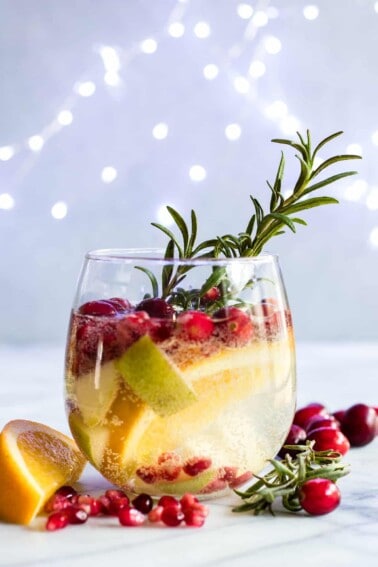 Sparkling White Sangria. This festive drink is super easy to put together and definitely makes a statement. Loaded with cranberries, pears, and oranges this drink is perfect for celebrating the Holidays! 