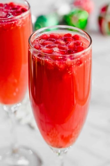 Christmas Mimosas! Celebrate Christmas in the morning with this mimosa that has a combination of orange juice and pomegranate juice! 