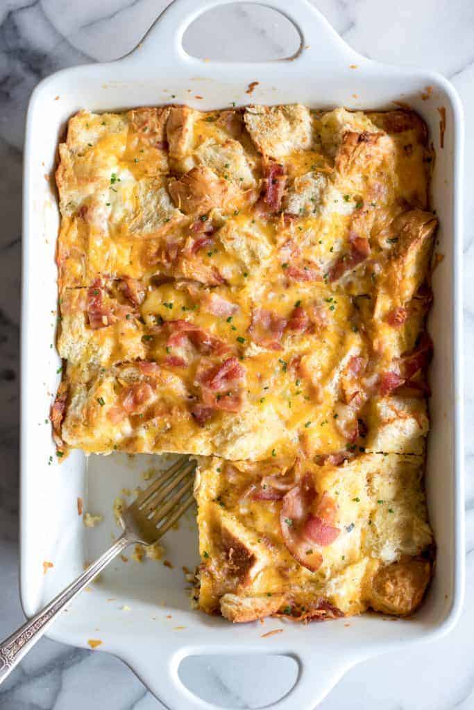 Overnight Bacon and Cheese Strata. This prep ahead breakfast is loaded with eggs, bacon and cheese.
