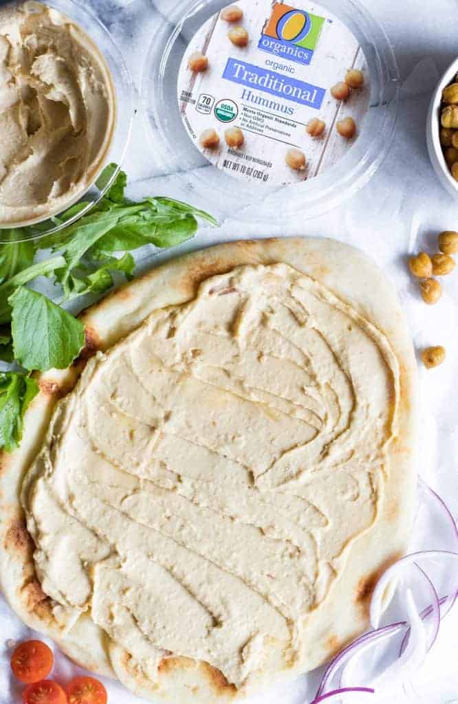 Flatbread topped with hummus. 