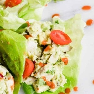 Overhead of lettuce cups filled with avocado chicken salad