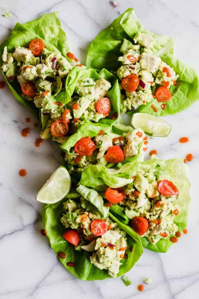 Lettuce cups filled with avocado chicken salad.