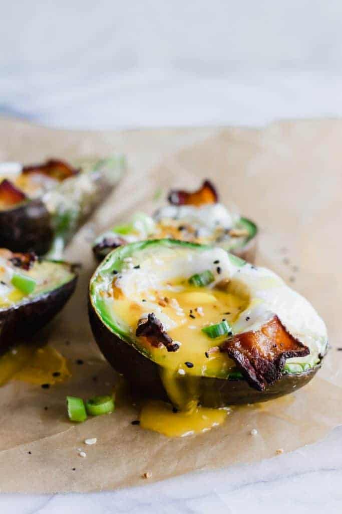 Avocado Baked Eggs with runny yolk and bacon