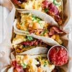 Texas Style Breakfast Tacos. Breakfast tacos loaded up with breakfast potatoes, scrambled egg, bacon and topped with cilantro.