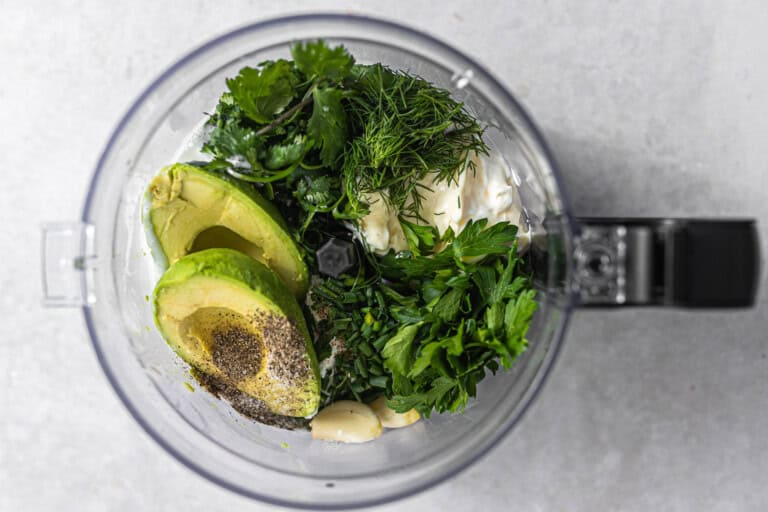 Ingredients for avocado ranch in a processor.
