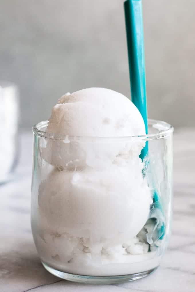 Glass Cup filled with scoops of coconut sorbet.