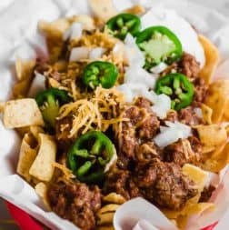 Tray filled with Frito pie made with 20 minutes Texas chili.