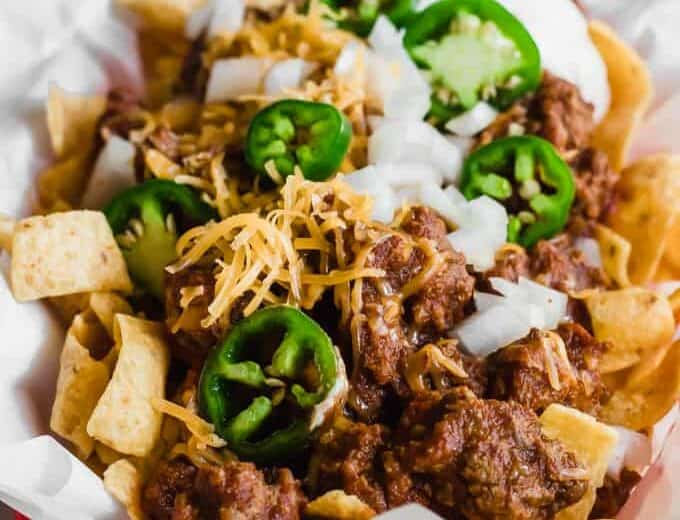 Tray filled with Frito pie made with 20 minutes Texas chili.