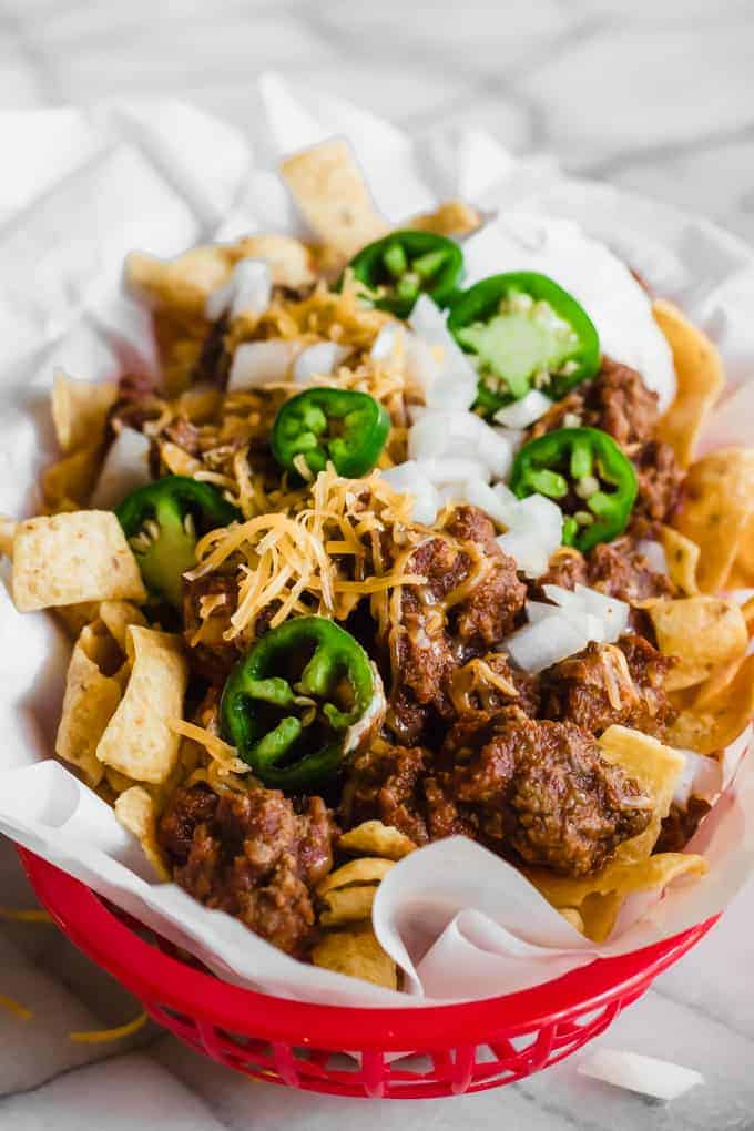 Tray filled with Frito pie made with 20 minutes Texas chili.