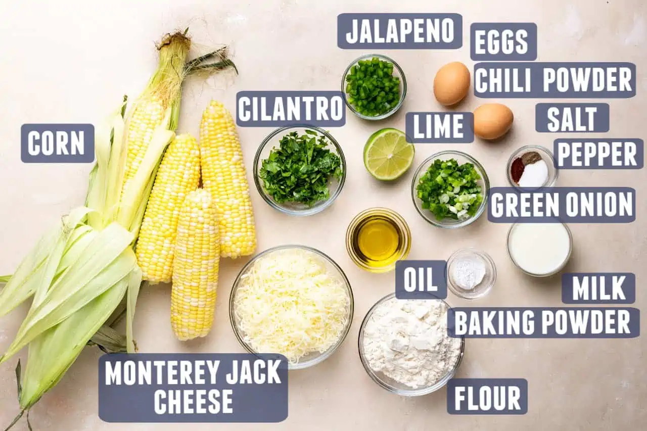 Ingredients needed for making cheesy corn fritters laid out on the counter.