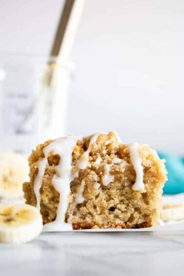 Slice of Banana Bread Crumb Cake with a drizzle of icing.