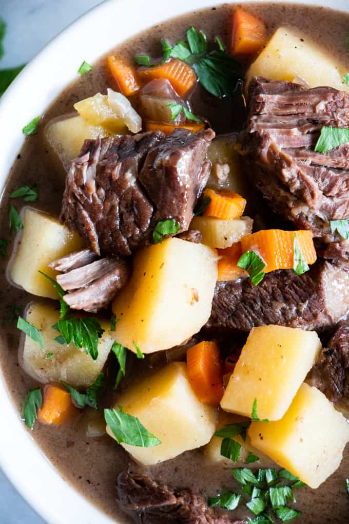 Bowl filled with ultra comforting beef stew! This classic recipe is made with chuck roast, potato and carrots. 