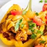 Baked taco stuffed pepper topped with melted cheese.