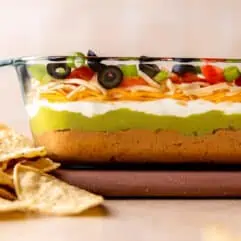 Glass dish showing layers in the seven layer dip.