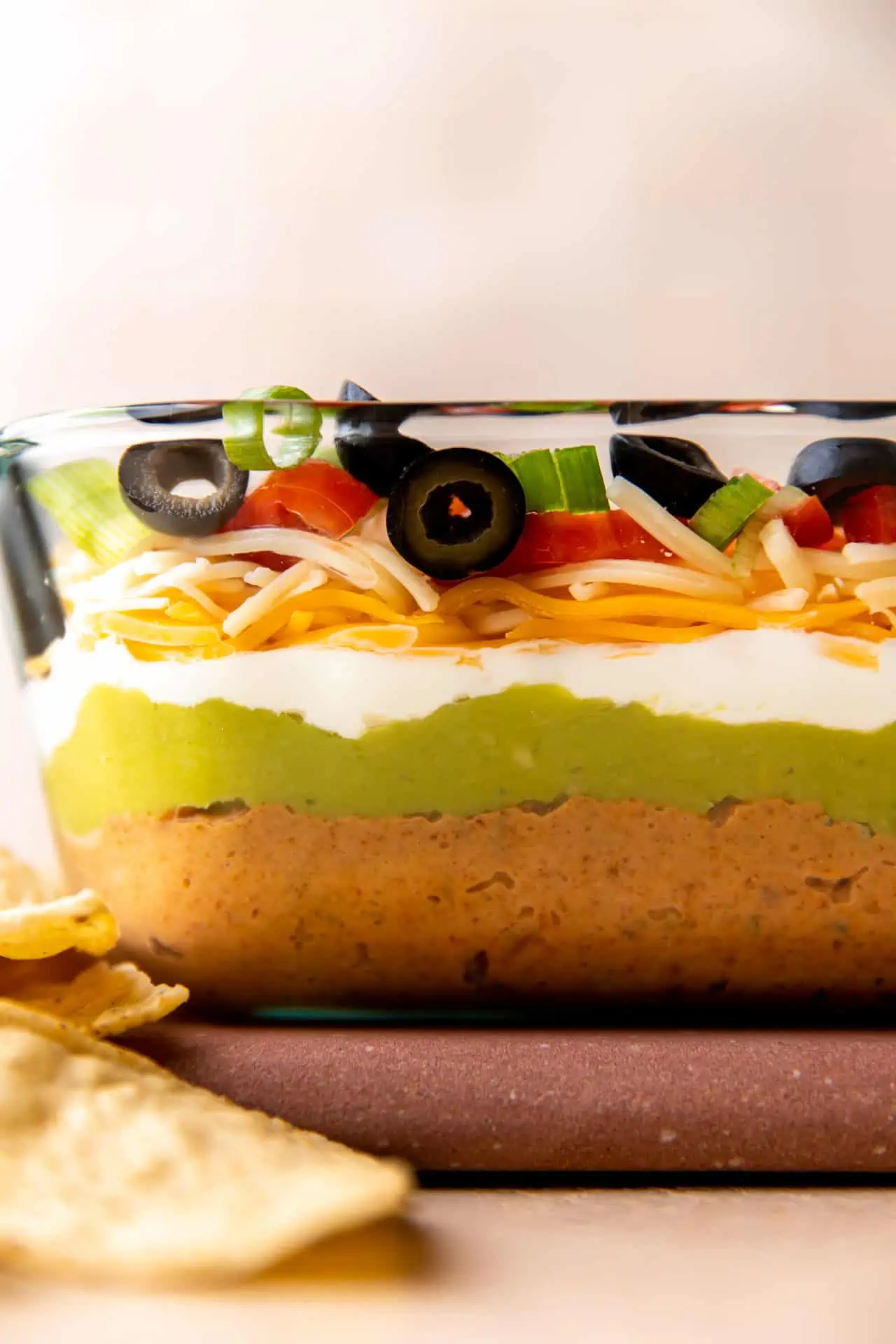 Glass dish showing layers in seven layer dip.