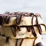 Stack of Chocolate Chip Shortbread cookies drizzled with extra chocolate.