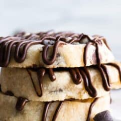 Stack of Chocolate Chip Shortbread cookies drizzled with extra chocolate.