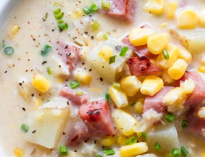 Close up of hearty corn chowder made with ham and potato.
