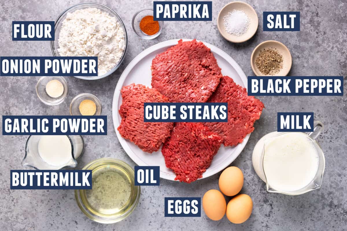 Ingredients needed to make chicken fried steak laid out on the counter. 