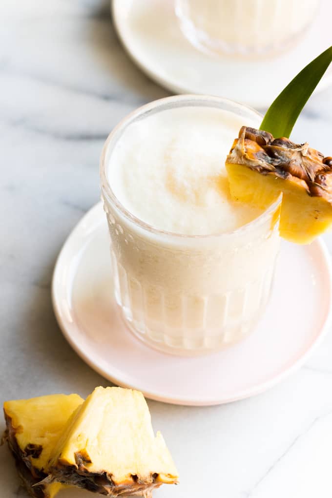 A Pina Colada served with chunks of pineapple. 