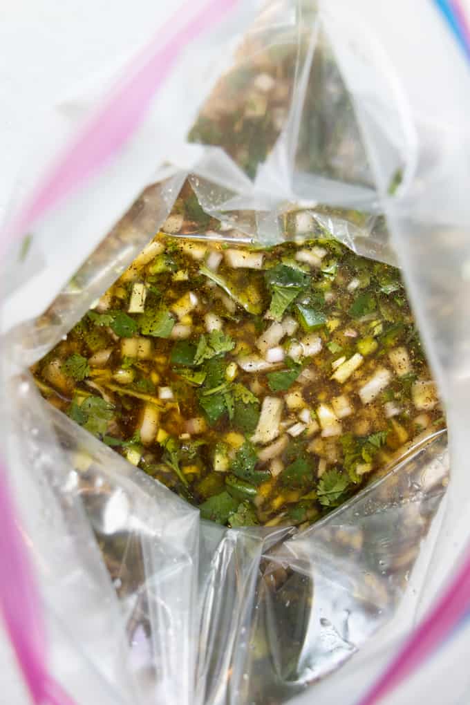 Marinade ready and in a plastic bag for making Tex Mex street tacos with skirt steak.