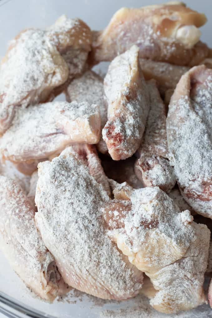 Chicken wings coated in a mixture of baking powder, salt and pepper to make baked Chili Lime Chicken Wings.