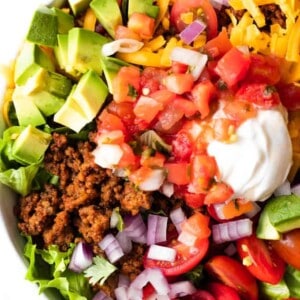 Taco Salad layered and ready to mix.